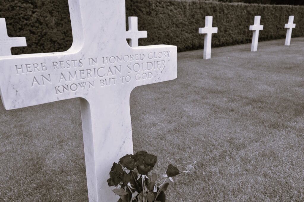 Cross marking resting place of unkonwn American soldier in Flanders American Cemetery